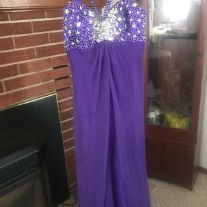 Purple beaded prom dress with elegant straps.